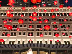 01B Looking up at the Peninsula Hotel Hong Kong with red Chinese lanterns at night